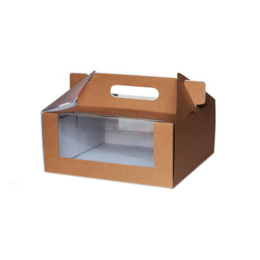 A corrugated cardboard cake box with a clear front window, brown body, and a handle on top.