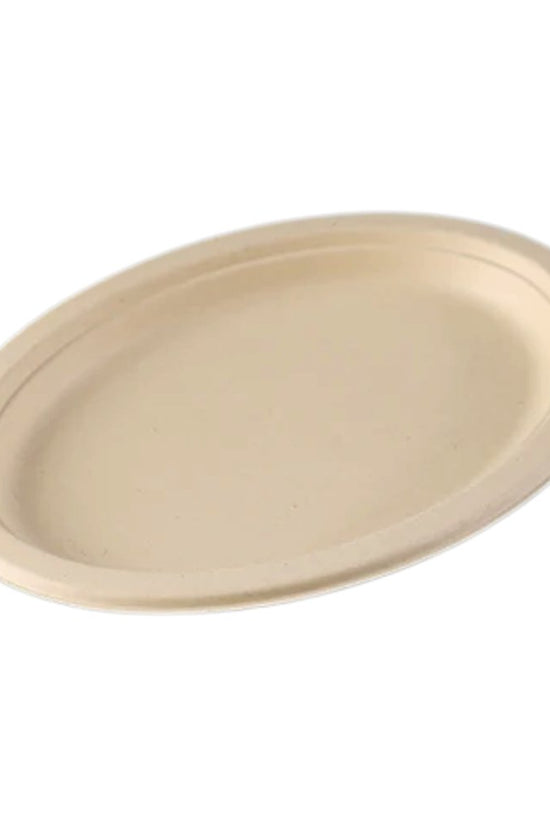 A single beige oval-shaped sugarcane plate on a plain background.