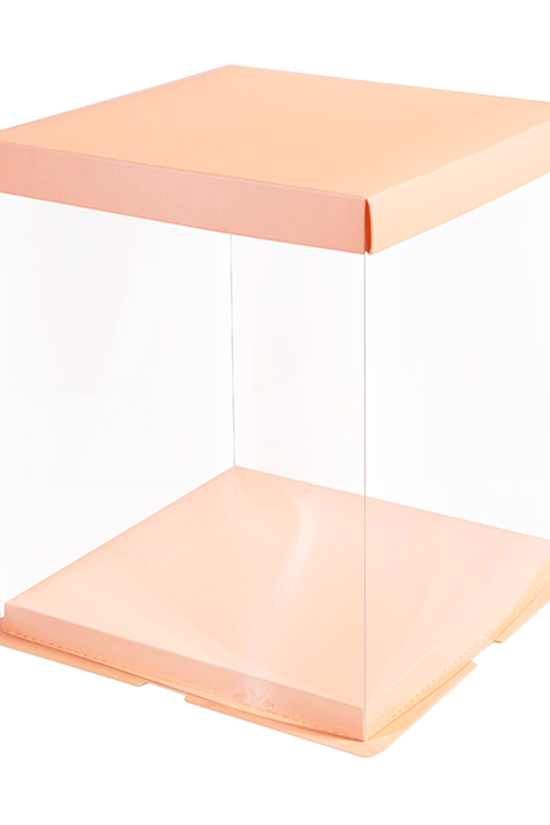 Clear acrylic box with peach-colored lid and base on a white background
