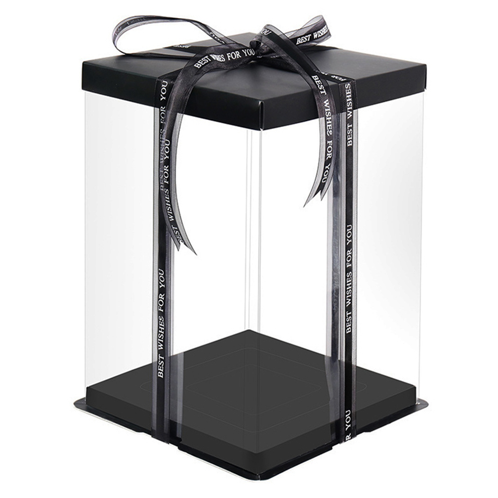 Black gift box with clear lid and ribbon on a white background
