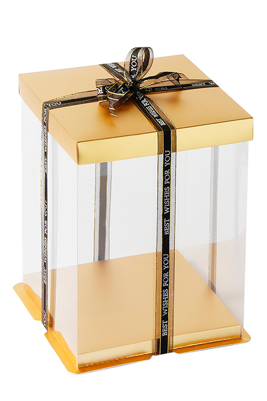 Gold gift box with a clear front and black ribbon on a white background